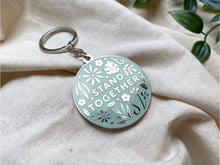 Load image into Gallery viewer, Stand Together Metal Keychain
